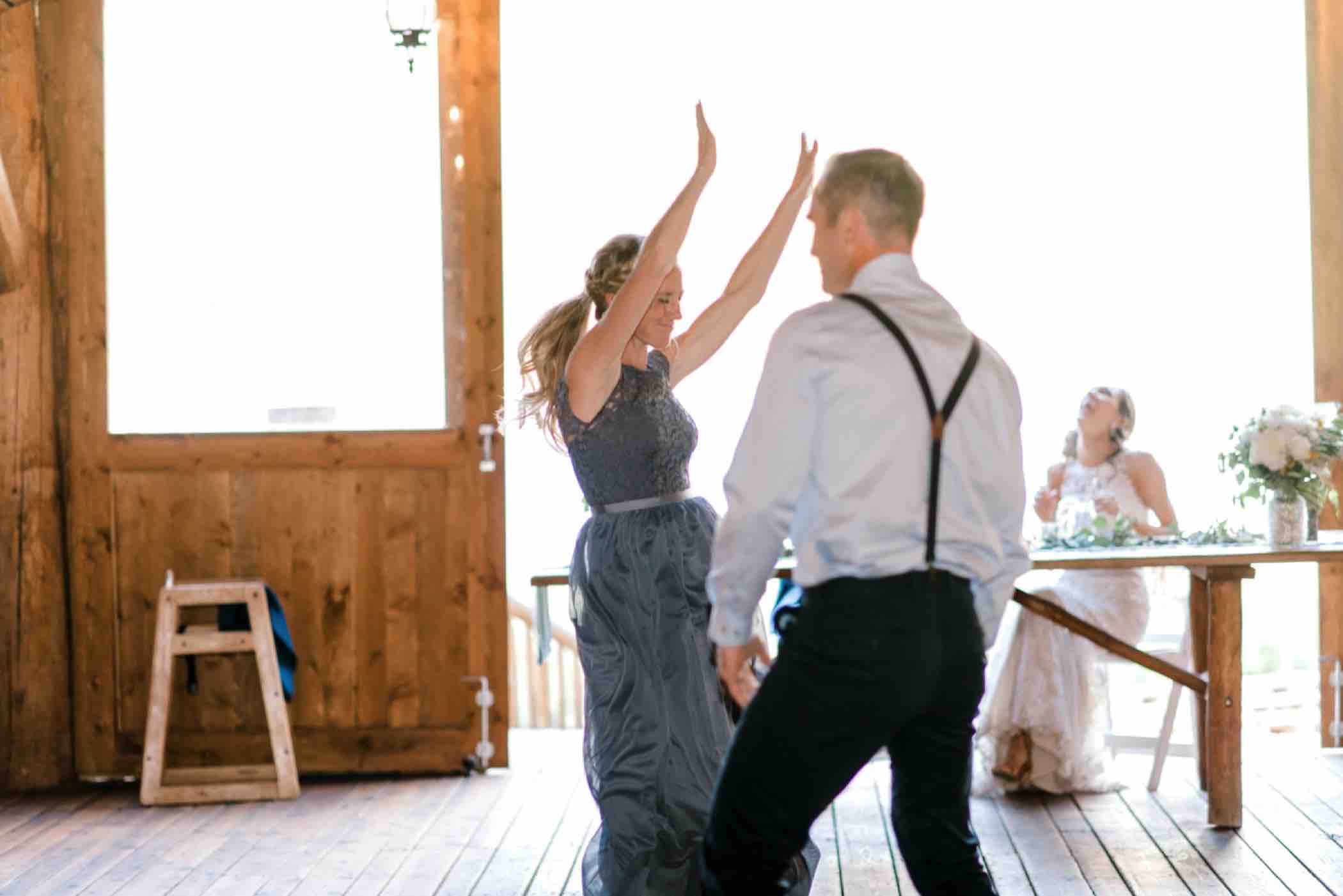 The best man and maid of honor had a dance off to see who would deliver their toasts first at Piney River Ranch in Vail, Colorado. Photo by Ali and Garrett, Romantic, Adventurous, Nostalgic Wedding Photographers.