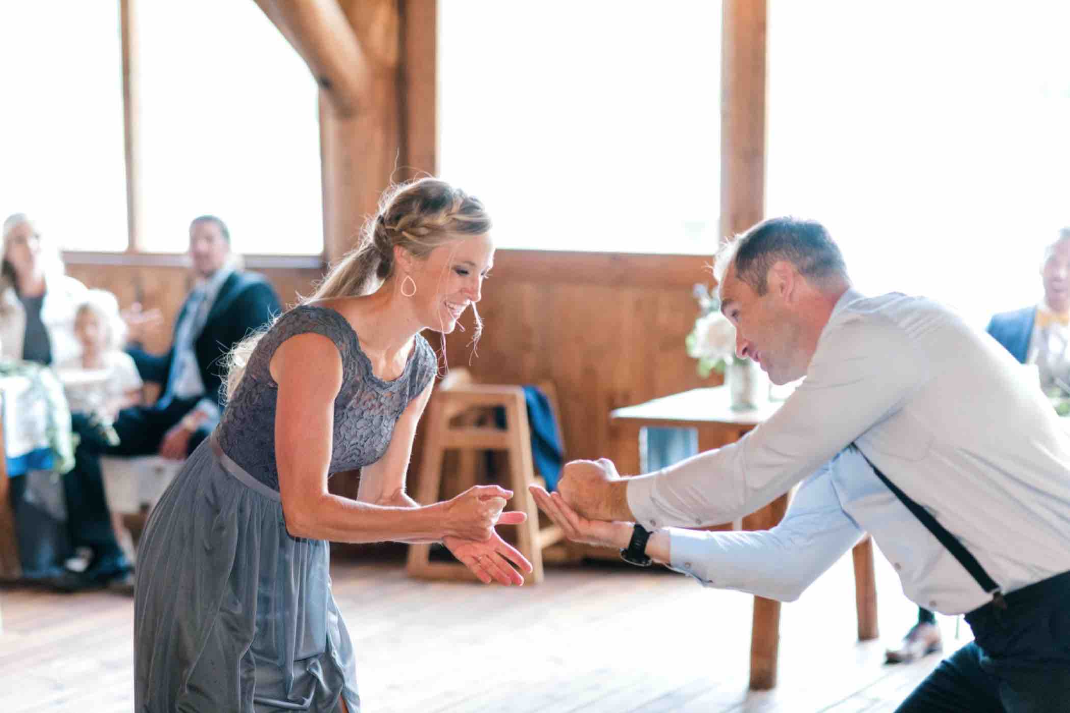 The maid of honor and best man played rock paper scissors to see who would give their toast first at Kris and Sallie's wedding in Piney River Ranch in Vail, Colorado.Photo by Ali and Garrett, Romantic, Adventurous, Nostalgic Wedding Photographers.