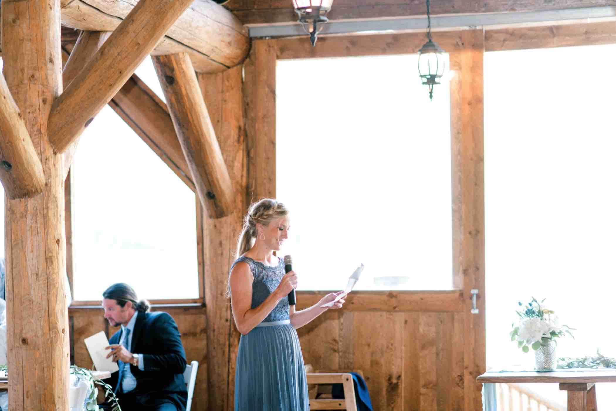 The maid of honor delivers a toast during Kris and Sallie's wedding at Piney River Ranch in Vail, Colorado. Photo by Ali and Garrett, Romantic, Adventurous, Nostalgic Wedding Photographers.