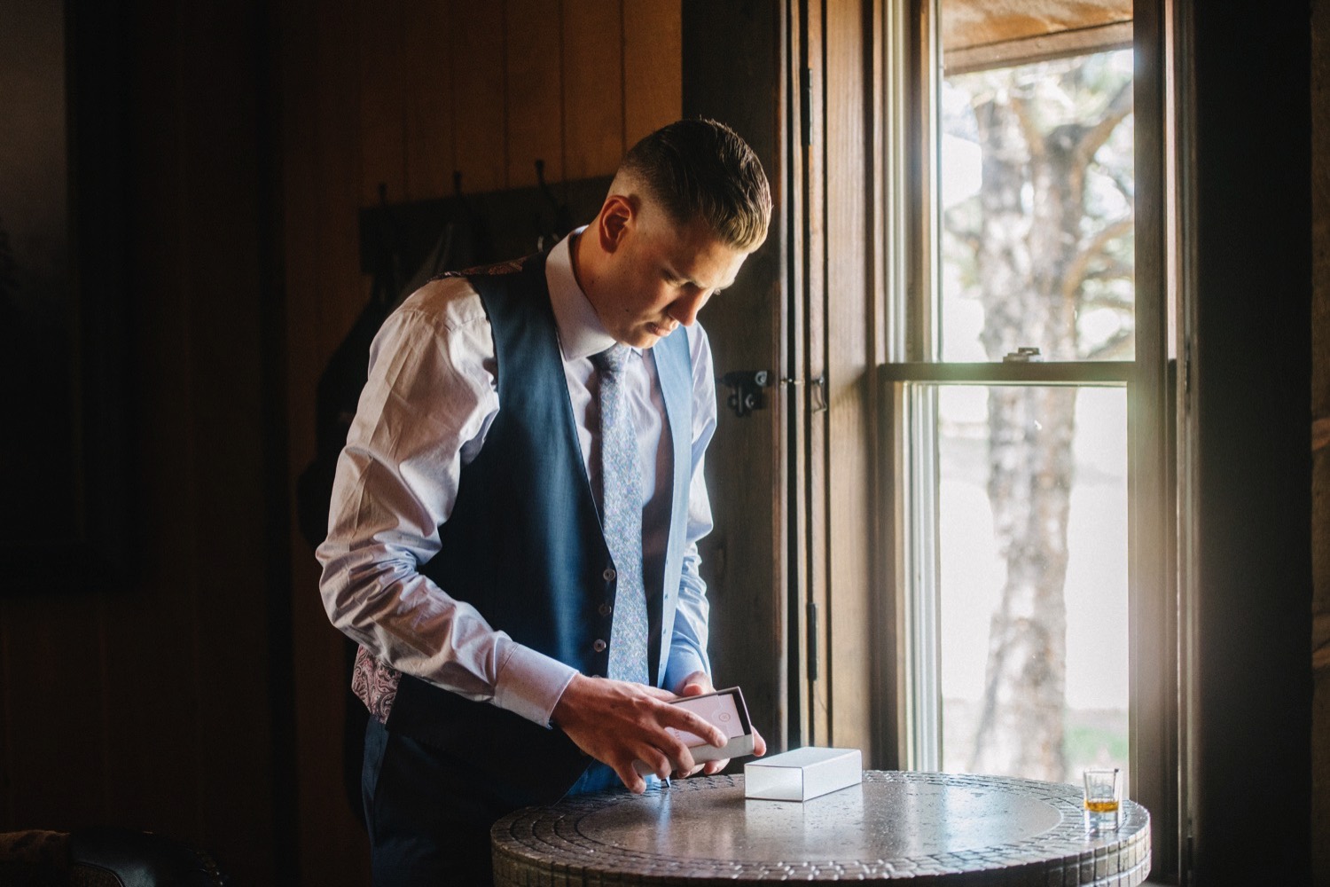 Charlton gets ready for his wedding at Spruce Mountain Ranch in Larkspur, Colorado.