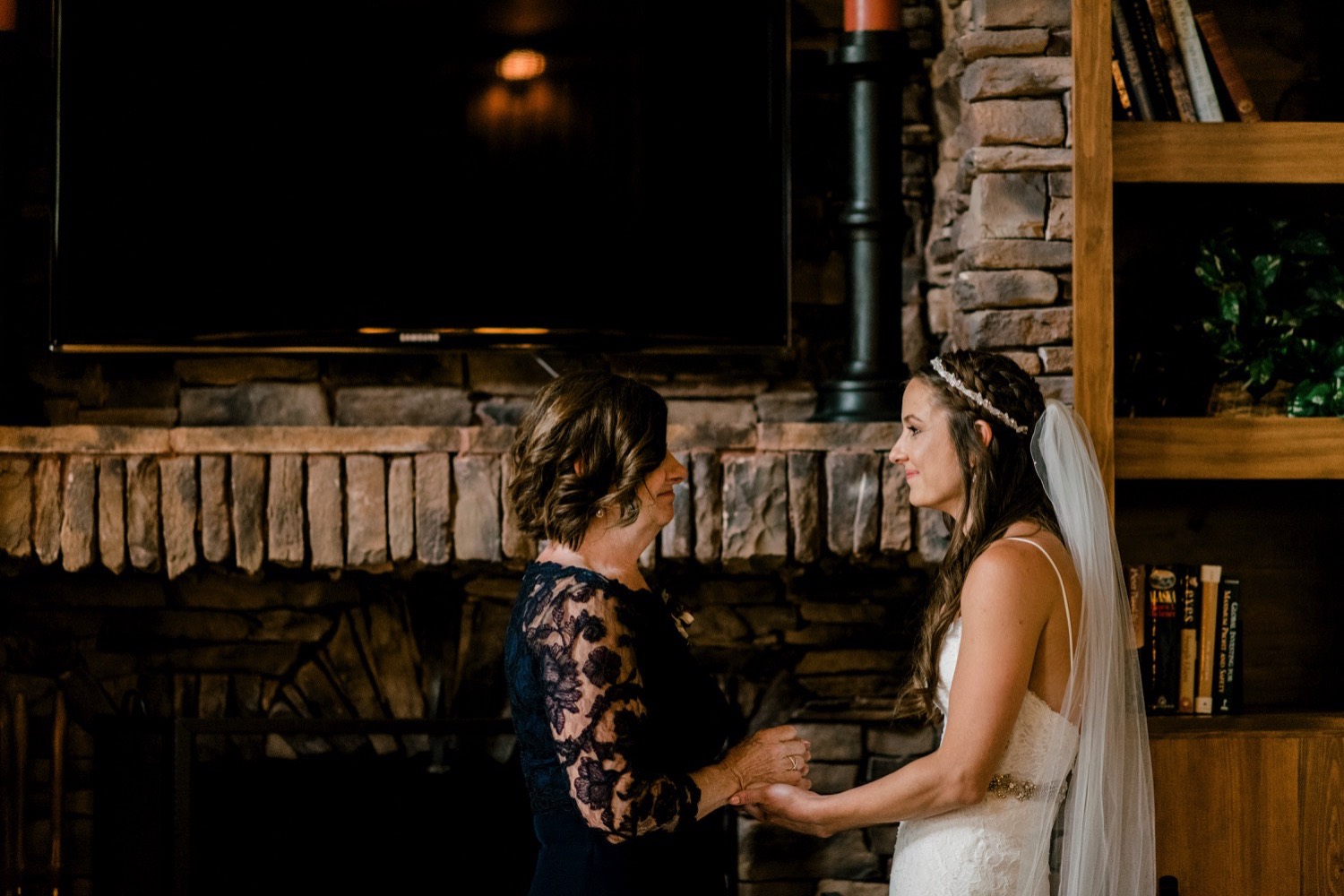 Kristen, the bride, and her mother have a quiet moment together before the start of their ceremony at Spruce Mountain Ranch in Larkspur, Colorado.