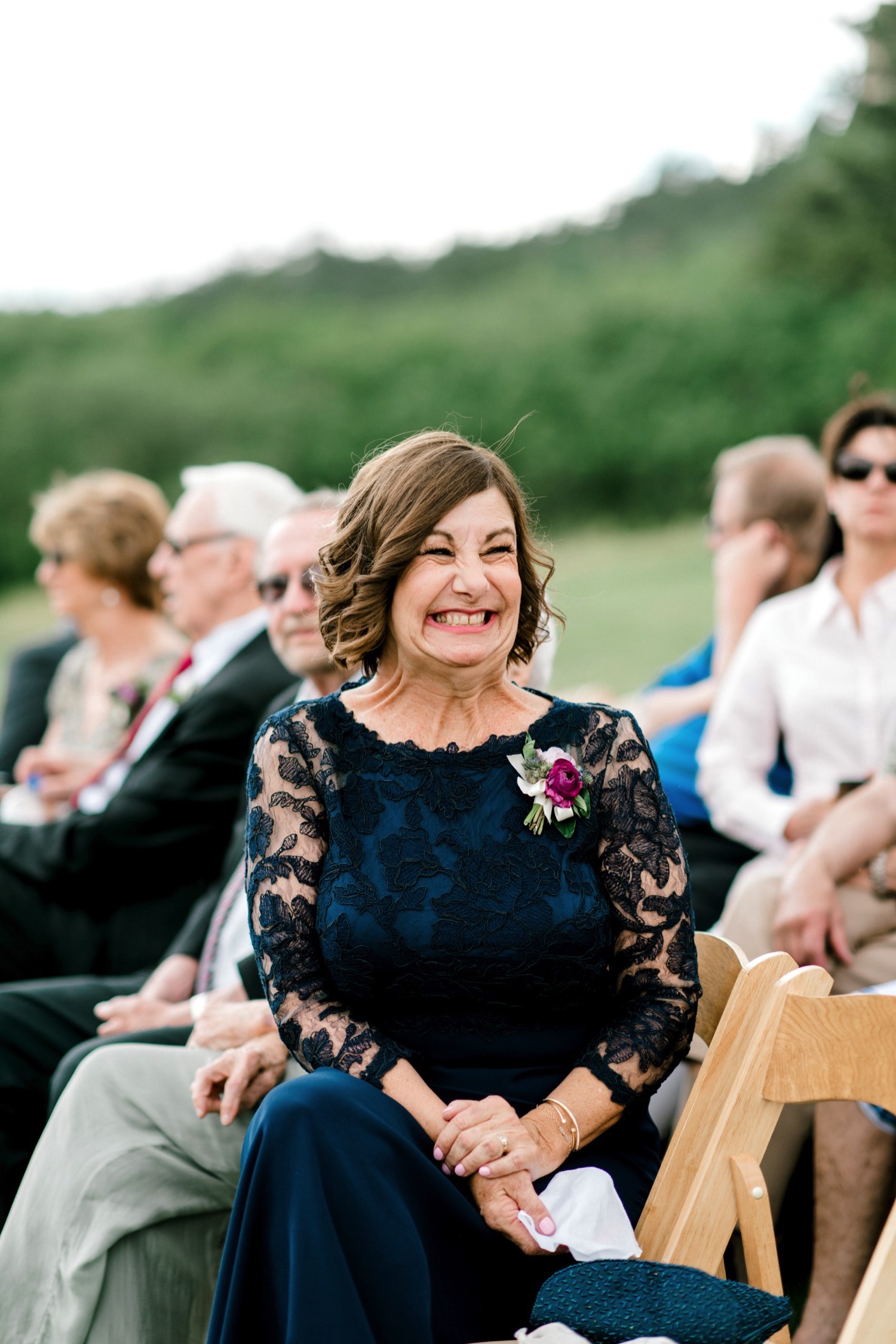 Guests, including the brides mother, were very excited for Kristen and Charlton's ceremony at Spruce Mountain Ranch in Larkspur, Colorado.