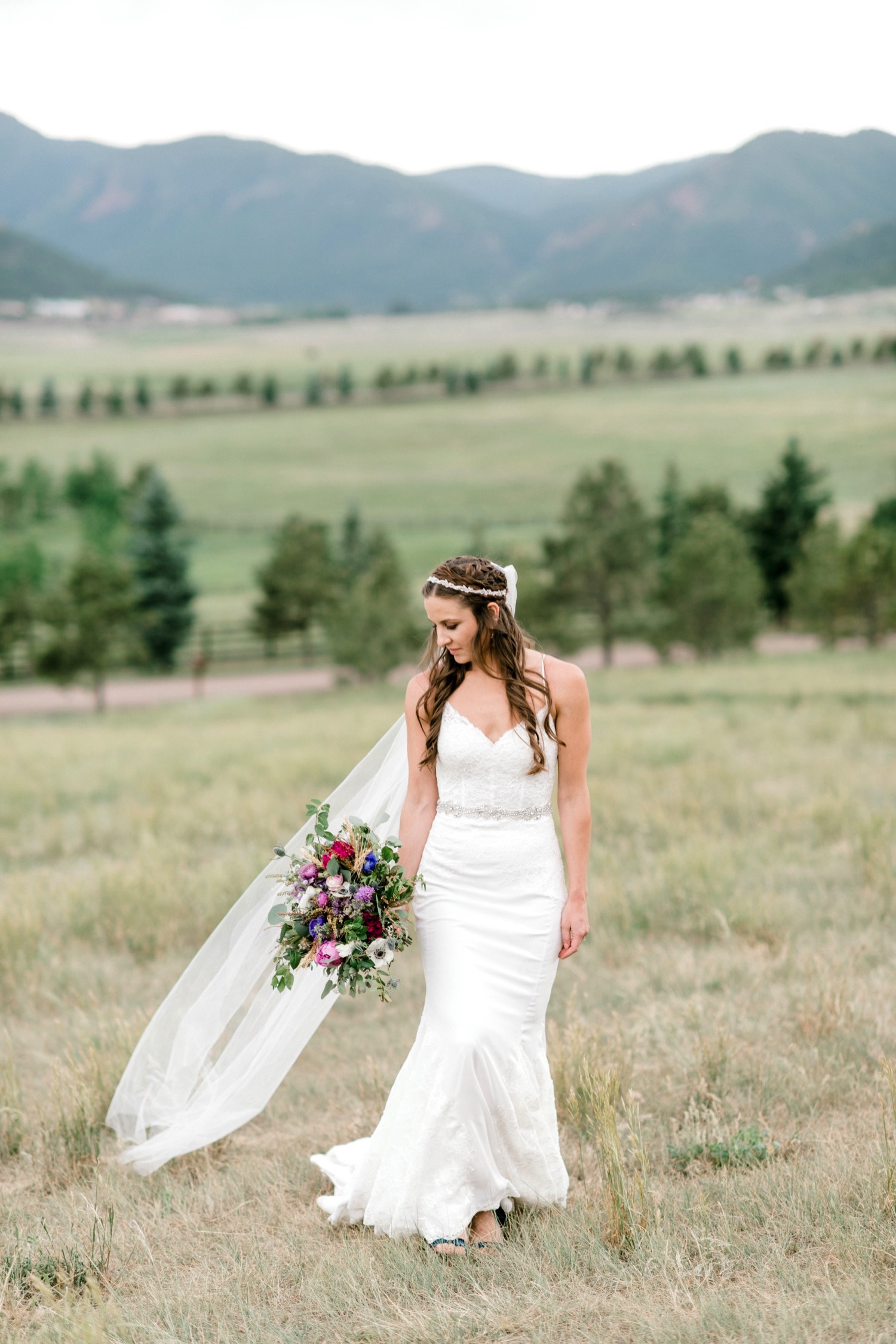 Kristen, the bride, poses for her bridal portrait at Spruce Mountain Ranch in Larkspur, Colorado.