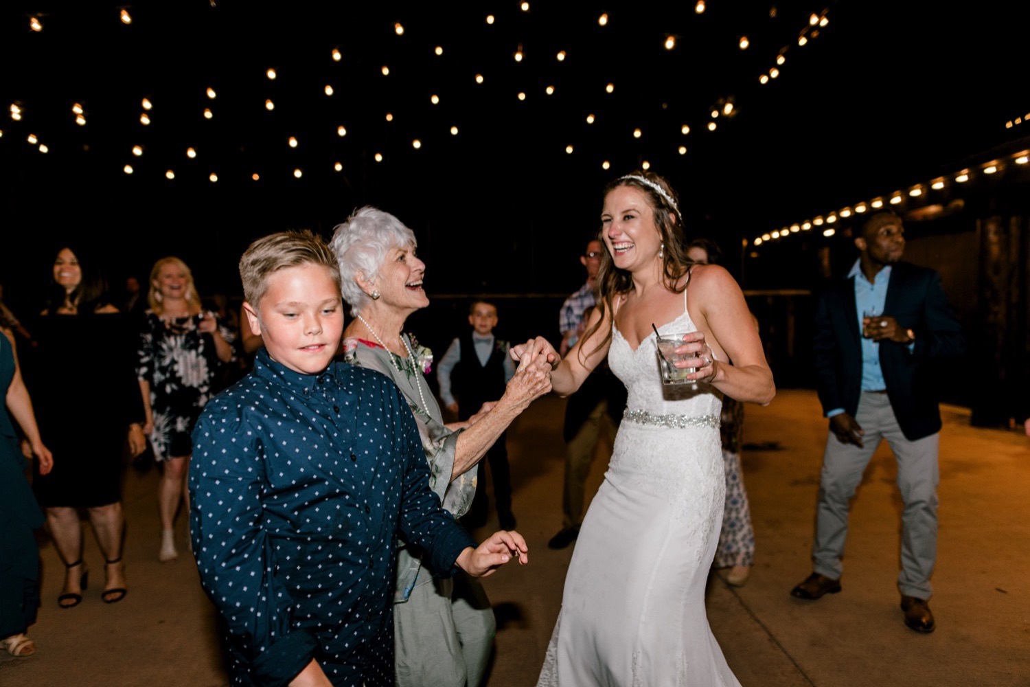 Kristen, the bride, dances with guests at Spruce Mountain Ranch in Larkspur, Colorado.