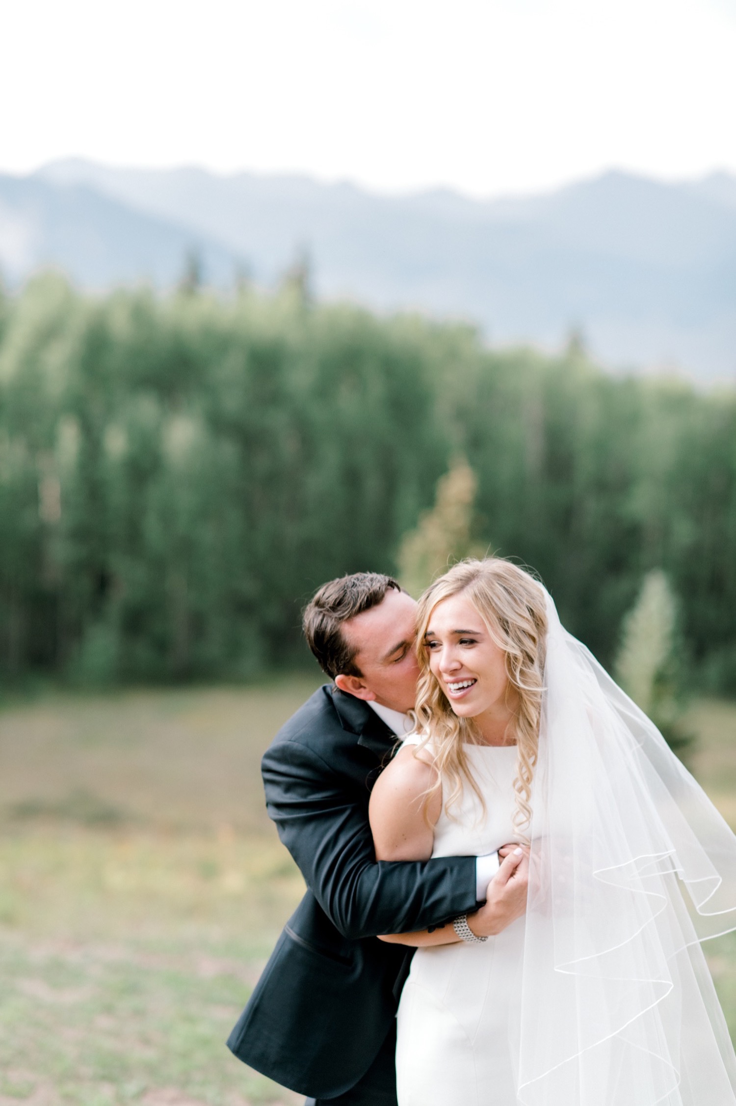 bride laughing crested butte wedding
