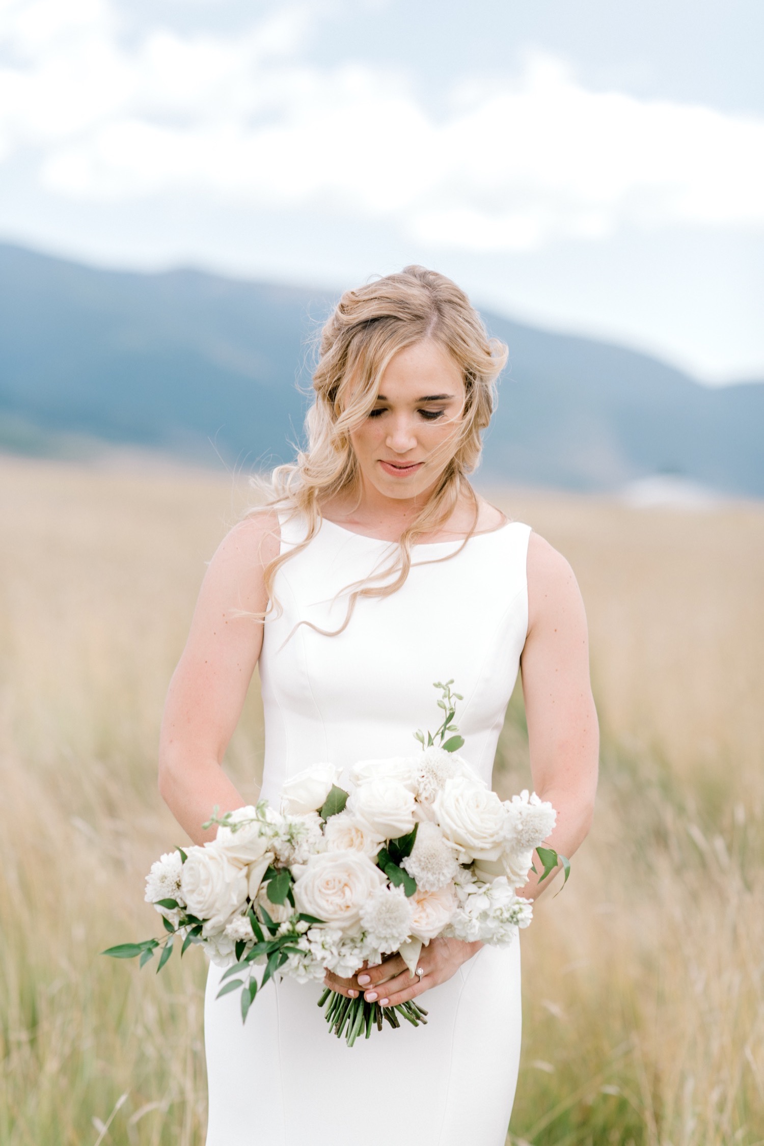 bride holding bouquet from olive and poppy crested butte wedding