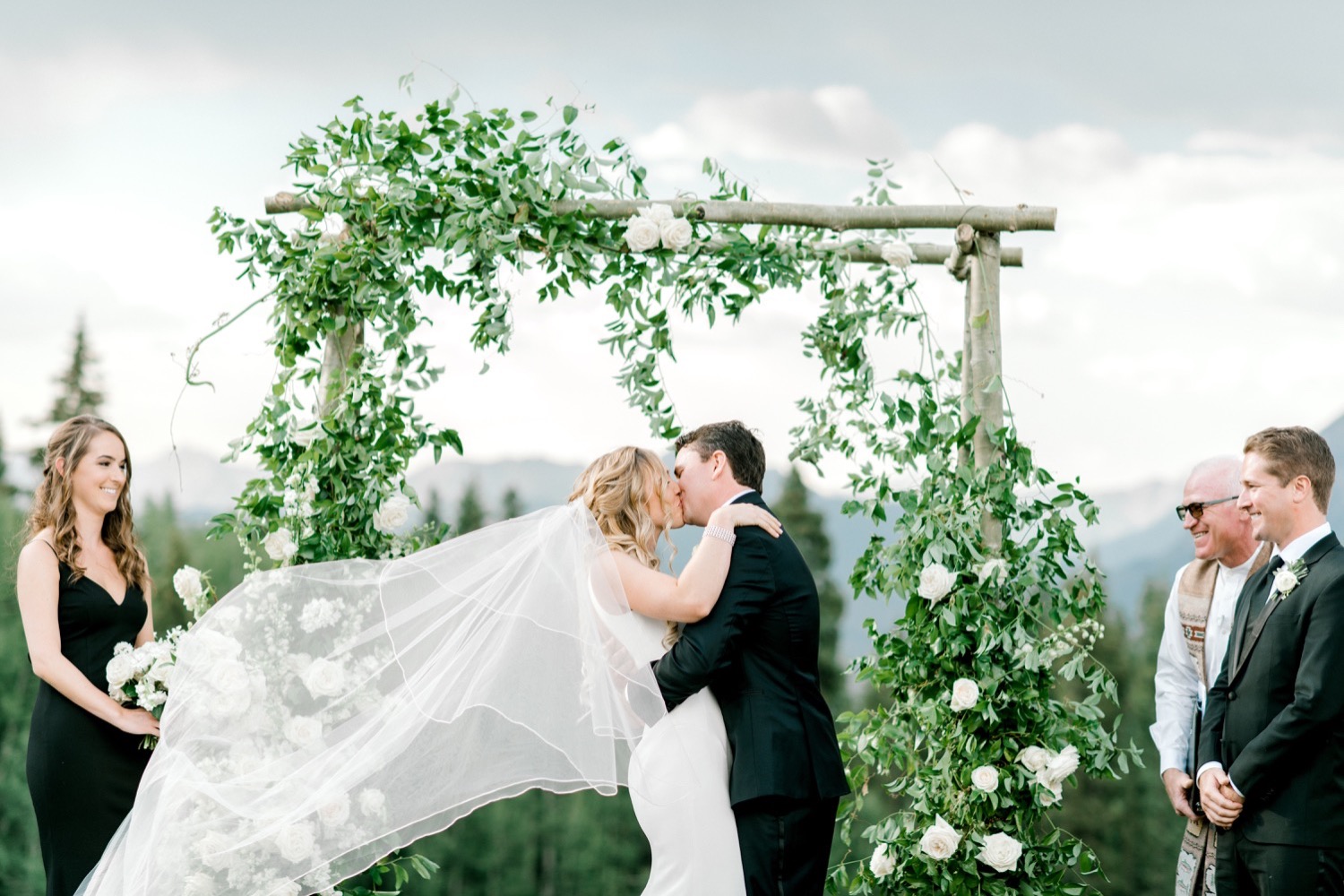 bride and groom first kiss crested butte wedding