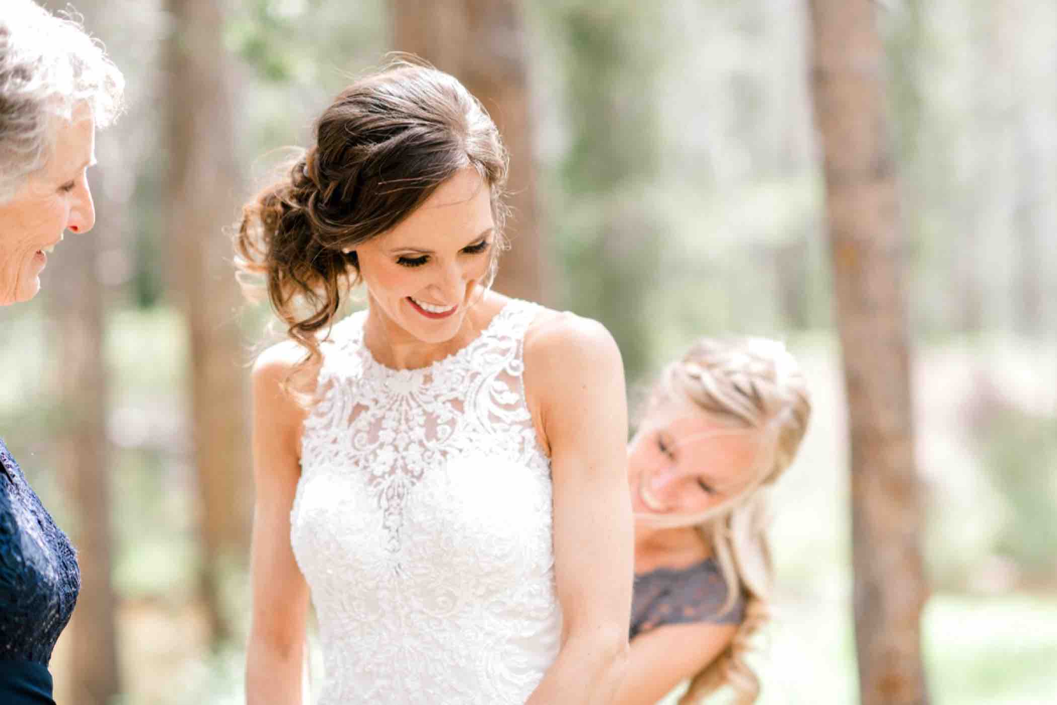 At Piney River Ranch in Vail, Sallie was an adventurous bride who chose to get ready outdoors and put her wedding dress outside. Photo by Ali and Garrett, Romantic, Adventurous, Nostalgic Wedding Photographers.