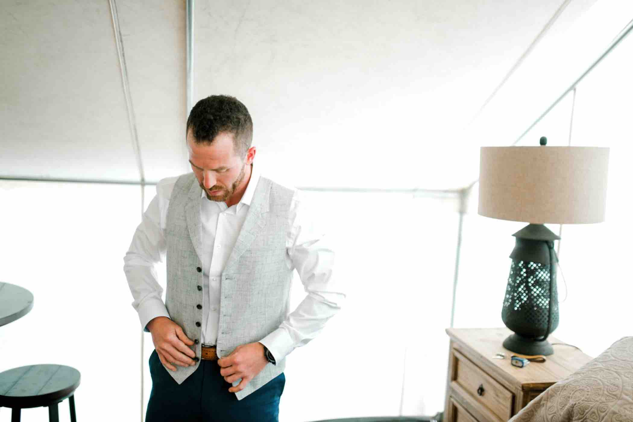 Kris gets ready for his wedding at Piney River Ranch in Vail, Colorado.Photo by Ali and Garrett, Romantic, Adventurous, Nostalgic Wedding Photographers.