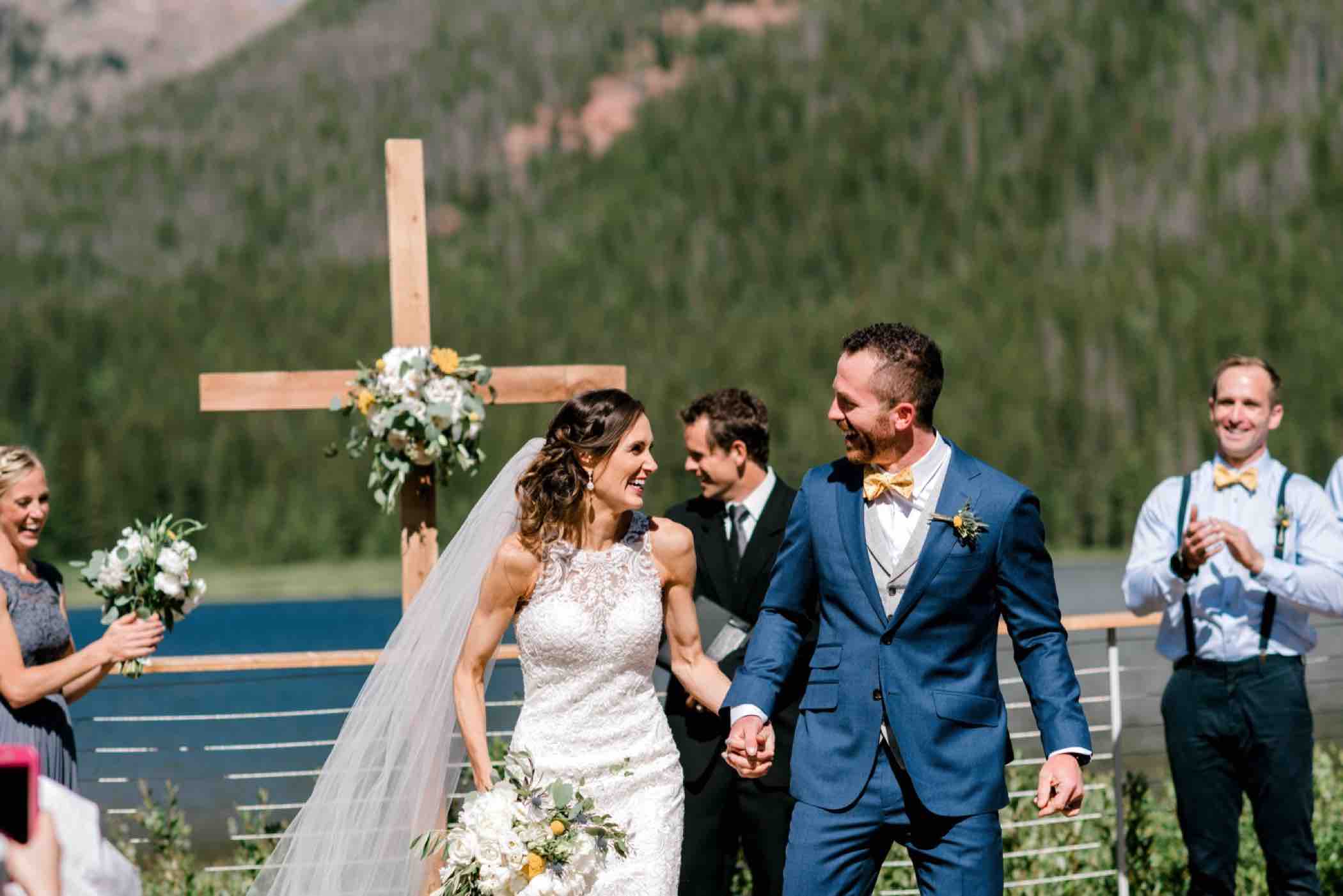 Bride and groom celebrate their wedding ceremony at Piney River Ranch in Vail in the Colorado Rocky Mountains. Photo by Ali and Garrett, Romantic, Adventurous, Nostalgic Wedding Photographers.