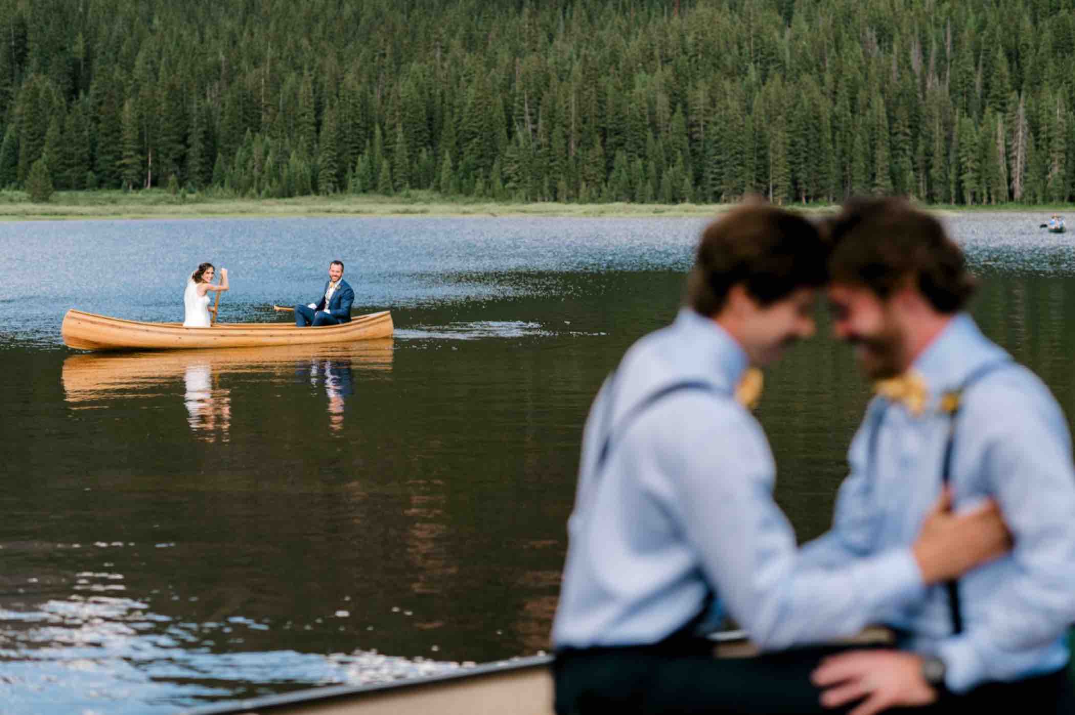 Bride and groom in a canoe at Piney River Ranch in Vail, Colorado. Photo by Ali and Garrett, Romantic, Adventurous, Nostalgic Wedding Photographers.