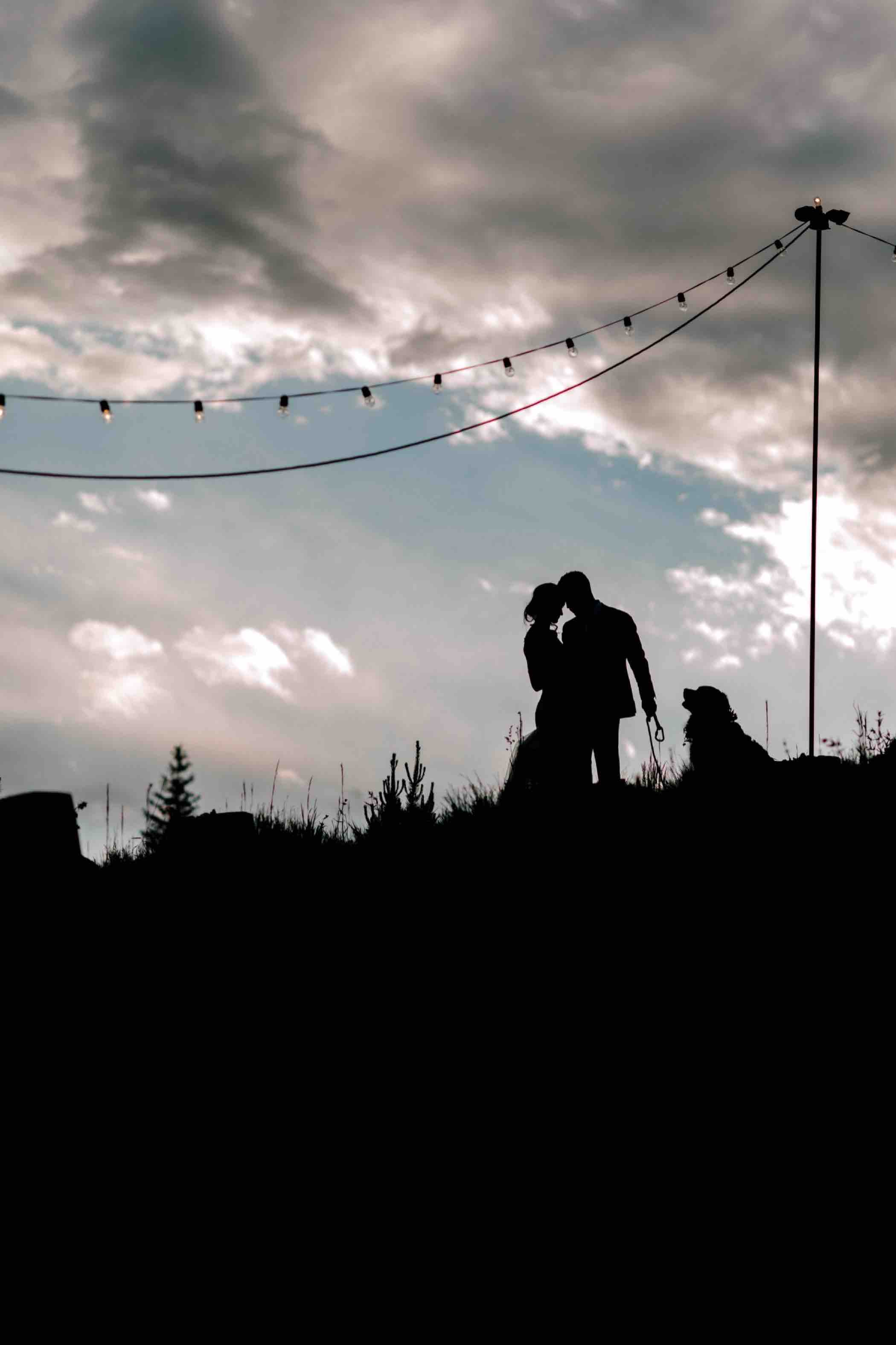 Bride and groom silhouette portrait at Piney River Ranch in Vail, Colorado. Photo by Ali and Garrett, Romantic, Adventurous, Nostalgic Wedding Photographers.