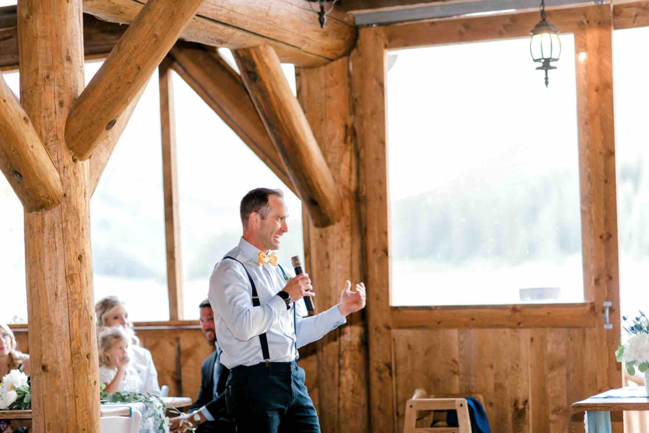 The best man delivers a toast at Kris and Sallie's wedding at Piney River Ranch in Vail, Colorado. Photo by Ali and Garrett, Romantic, Adventurous, Nostalgic Wedding Photographers.