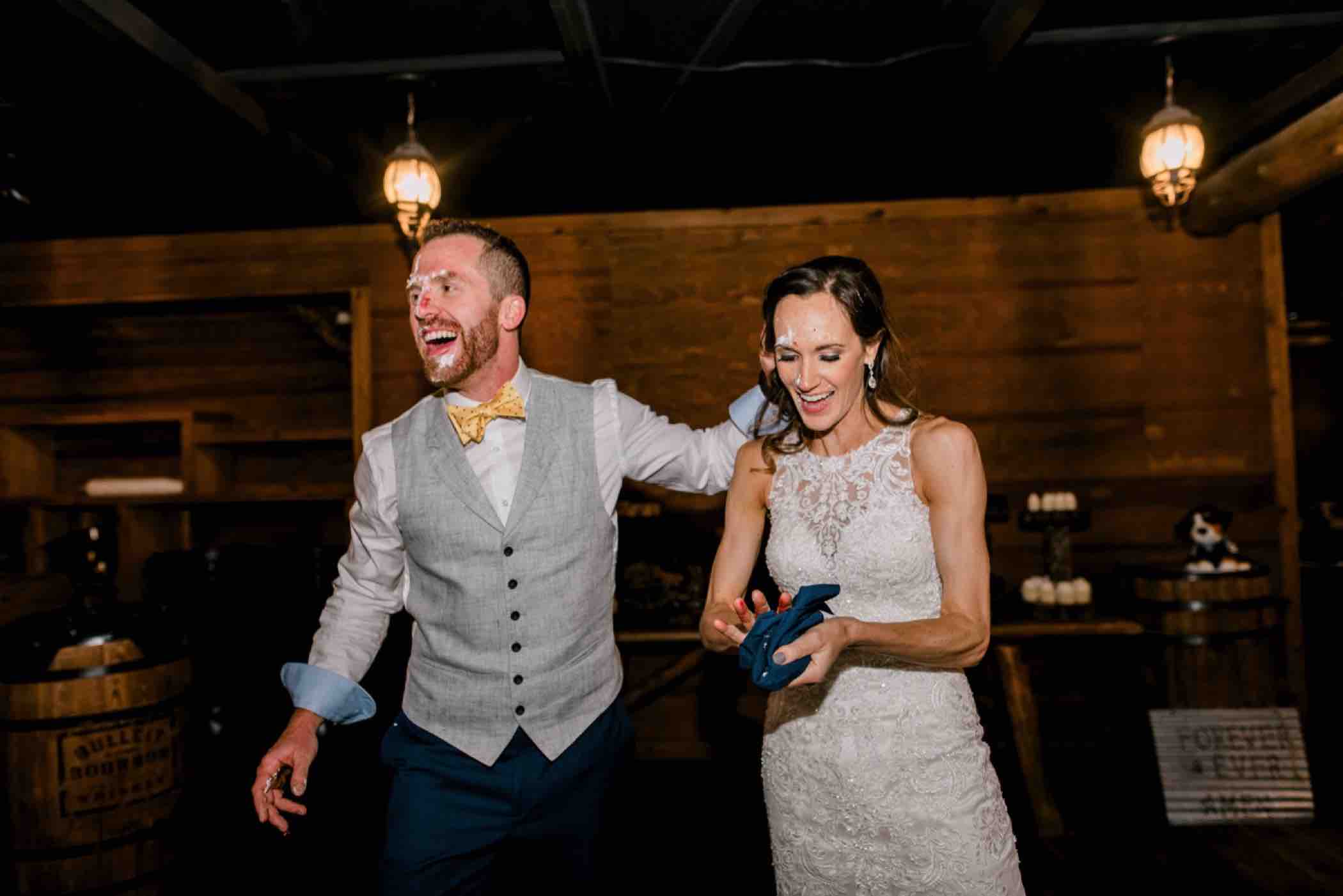 Kris and Sallie celebrate after cutting the cake at their wedding reception at Piney River Ranch in Vail Colorado. Photo by Ali and Garrett, Romantic, Adventurous, Nostalgic Wedding Photographers.