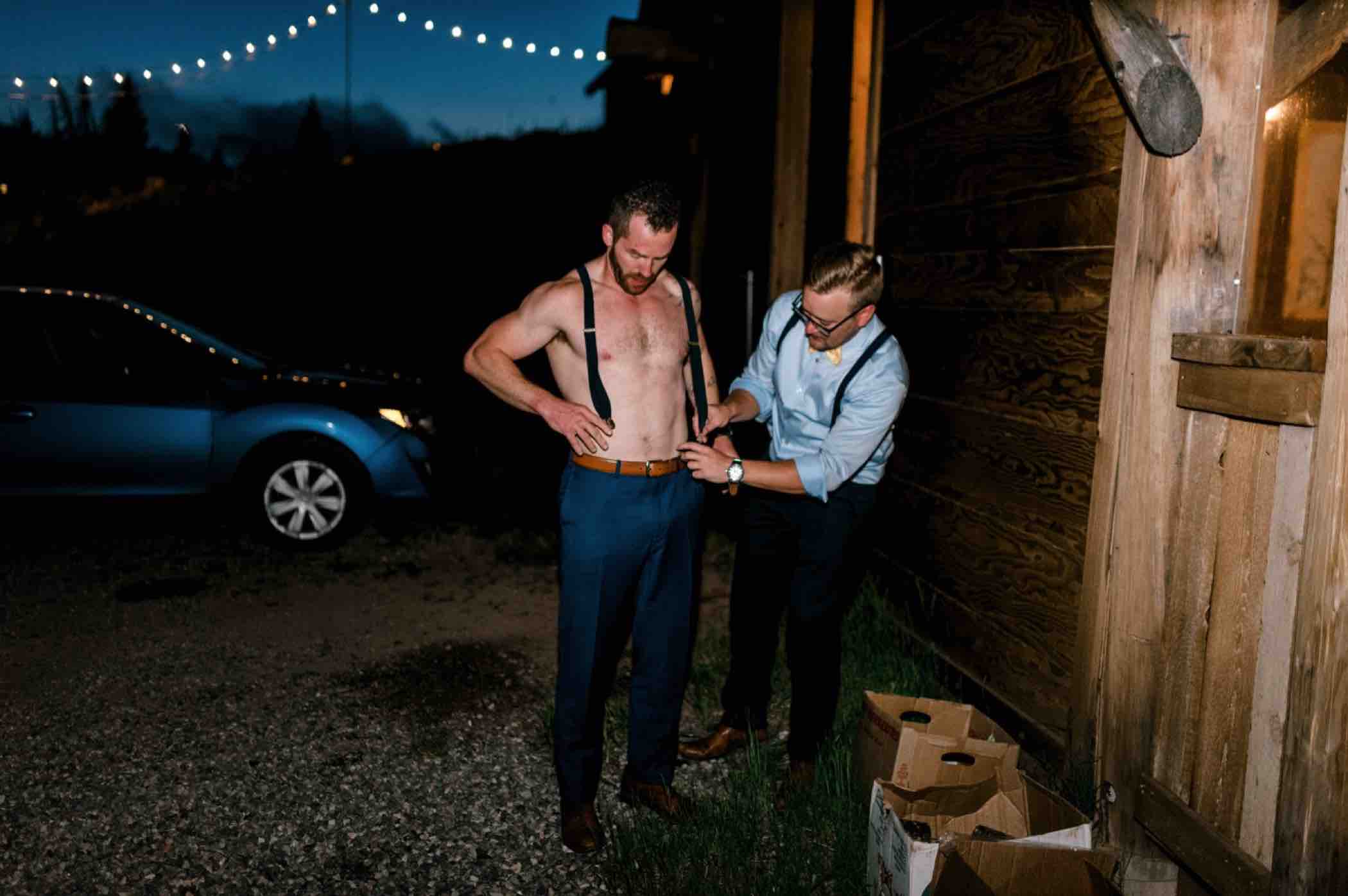 The groom got progressively more shirtless as the night went on during the wedding reception at Piney River Ranch in Vail, Colorado. Photo by Ali and Garrett, Romantic, Adventurous, Nostalgic Wedding Photographers.