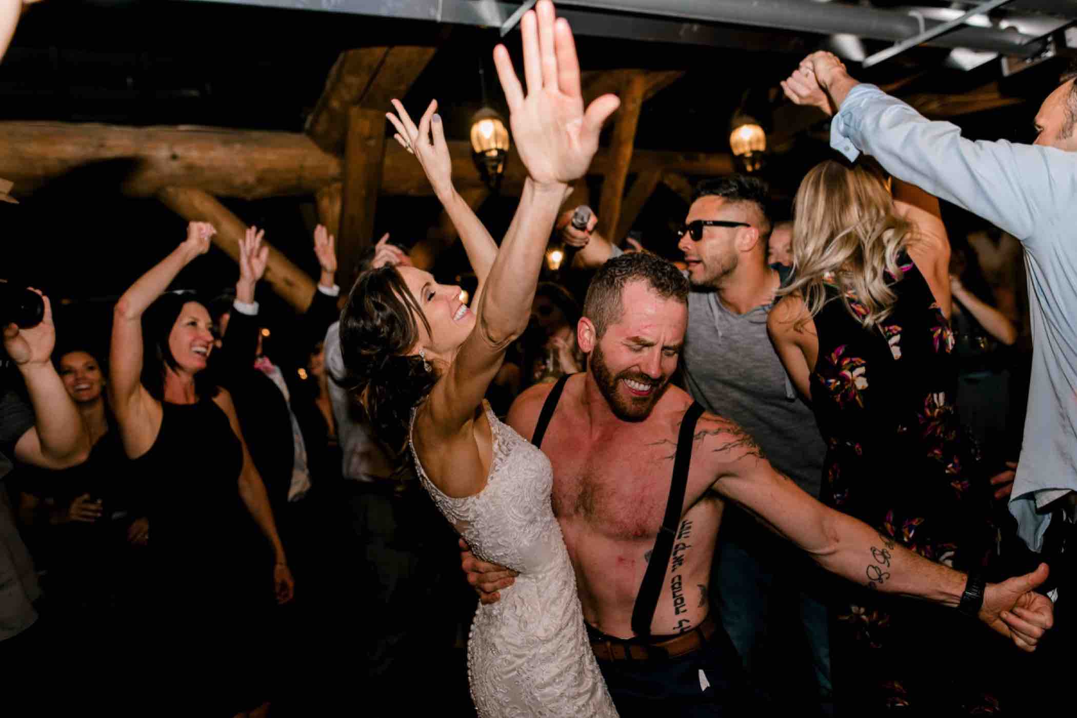 The bride and groom dance during their reception at Piney River Ranch in Vail, Colorado. Photo by Ali and Garrett, Romantic, Adventurous, Nostalgic Wedding Photographers.