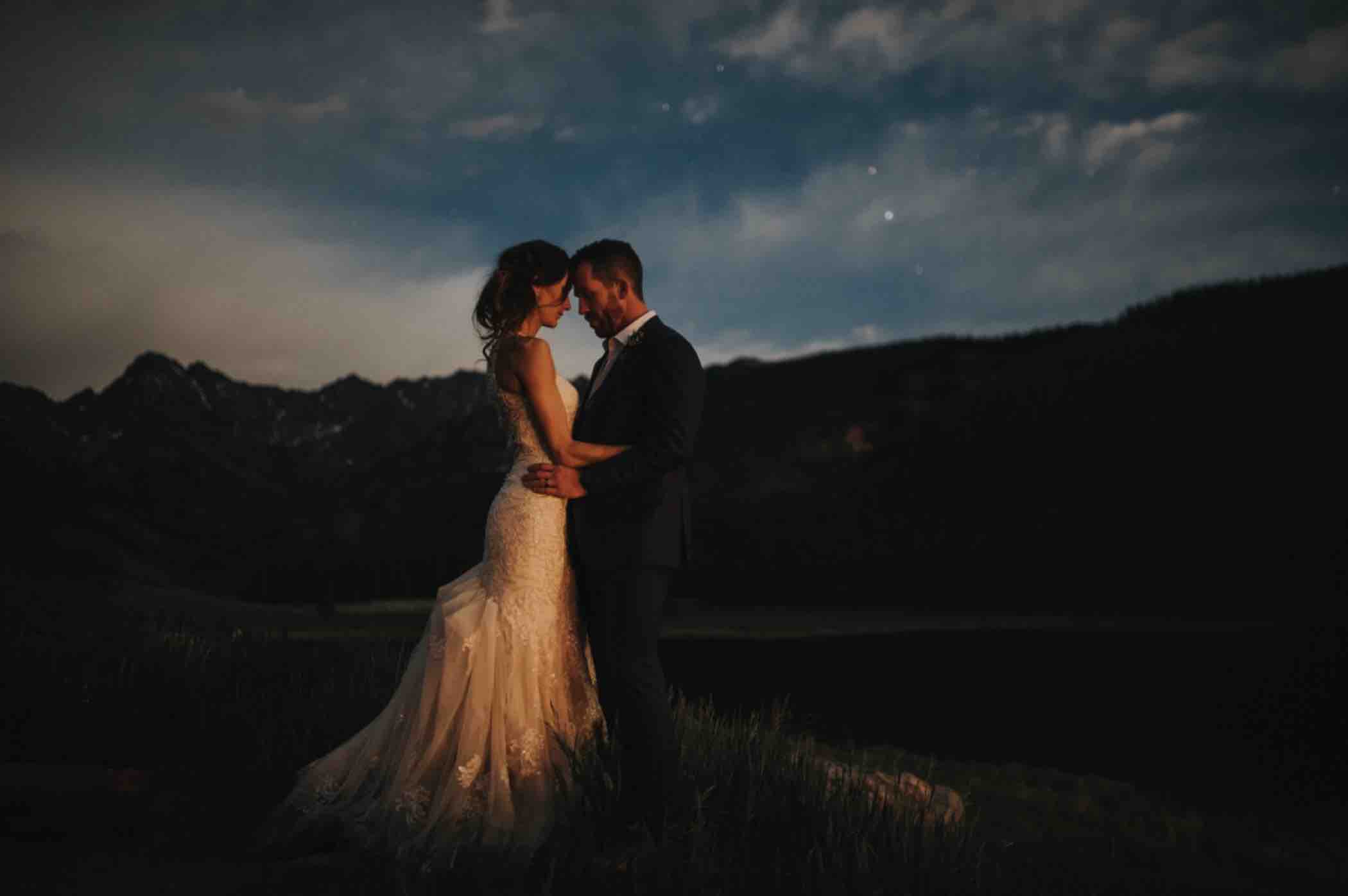 Bride and groom sunset portrait at Gore Range in Piney River Ranch in the White River National Forest outside Vail, Colorado. Photo by Ali and Garrett, Romantic, Adventurous, Nostalgic Wedding Photographers.