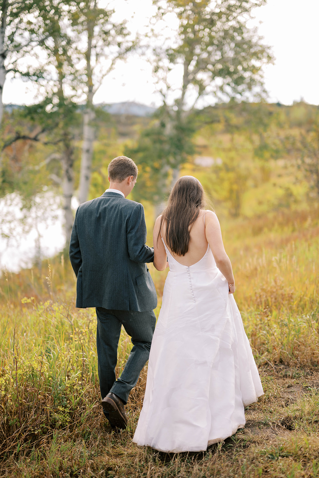 Newlywed Couple Holding Hands After Exchanging Wedding Vows